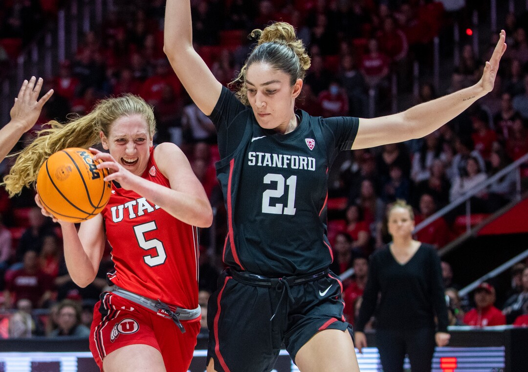 (Rick Egan | The Salt Lake Tribune) Utah Utes guard Gianna Kneepkens (5) goes to the hoop as Stanford Cardinal forward Brooke Demetre (21) defends, in PAC-12 action, at the Jon M. Huntsman Center, on Saturday, Feb. 25, 2023.