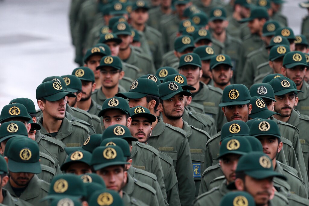 (Vahid Salemi | The Associated Press) In this Feb, 11, 2019 file photo, Iranian Revolutionary Guard members arrive for a ceremony celebrating the 40th anniversary of the Islamic Revolution, at the Azadi, or Freedom, Square, in Tehran, Iran.  President Donald Trump's administration is preparing to designate Iran's Revolutionary Guard as a "foreign terrorist organization." It's an unprecedented move that could have widespread implications for U.S. personnel and policy in the Mideast and elsewhere. U.S. officials say an announcement is expected Monday.