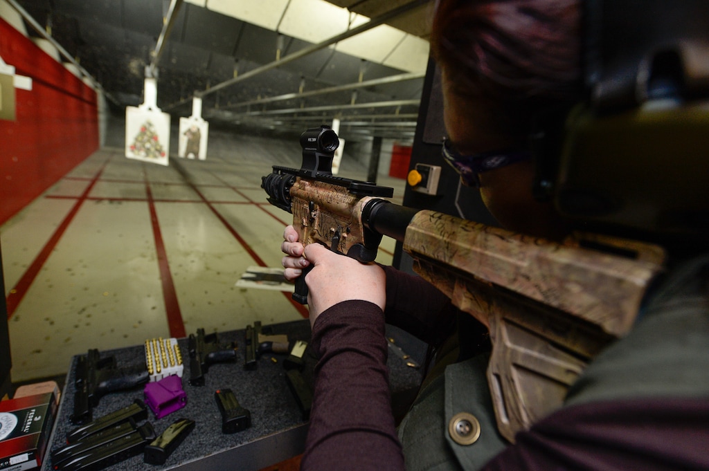 (Francisco Kjolseth  |  The Salt Lake Tribune)  NRA-certified instructor Michelle Camp takes aim with a custom Arm Lite 9mm as she joins other women at The Gun Vault shooting range in South Jordan May 23, 2018. The Utah House passed three new gun safety bills, including one that would create a pilot program for gun handling classes in Utah high schools.