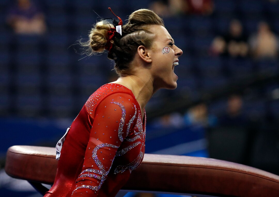 Utah's Tiffani Lewis celebrates after competing on the vault during the NCAA women's gymnastics championships Friday, April 14, 2017, in St. Louis. (AP Photo/Jeff Roberson)