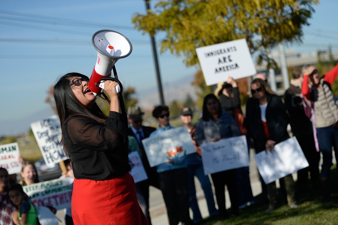 (Francisco Kjolseth  |  The Salt Lake Tribune)  Mayra Cedano of Communidades Unidas shouts "what do we do when immigrant families are under attack? we fight back" during a rally outside Immigration and Customs Enforcement offices in West Valley City on Monday, Oct. 16, 2017. Community members gathered to support Maria Santiago Garcia, a single Utah mother of four U.S. born children who faces an impending deportation order.