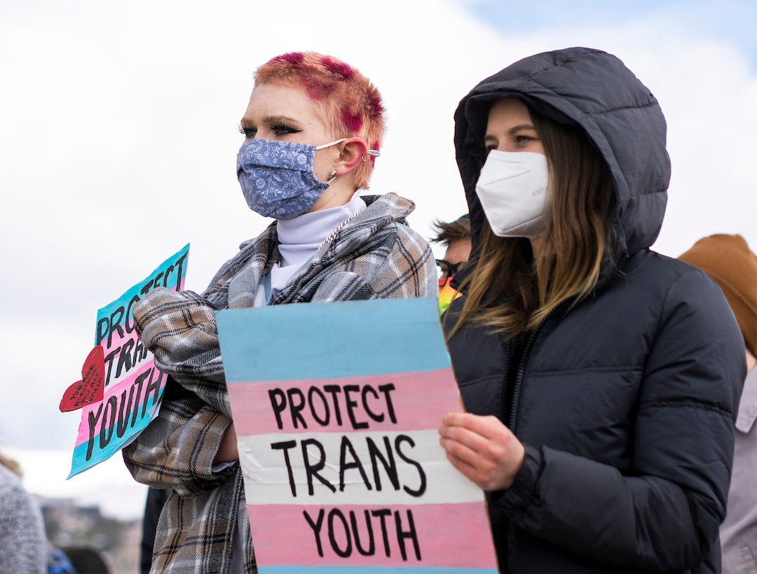(Rick Egan | The Salt Lake Tribune)   Ashley Olsen and Taya Unruch join more than 200 people on the steps of the Capitol for a rally, speaking out against Rep. Kera Birkeland's transgender sports bill, on Friday, Feb. 25, 2022.