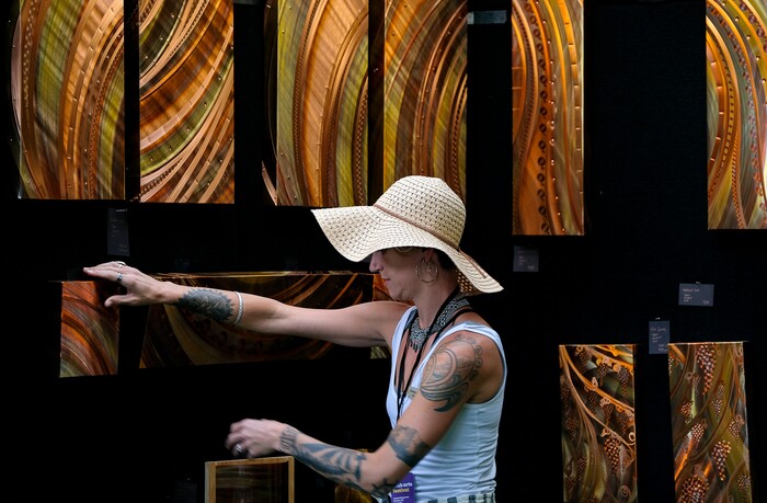 (Francisco Kjolseth  |  The Salt Lake Tribune)  Artist Jennah Litecky Yost works on her display at FireSmith Copper during the annual 2019 Utah Arts Festival as it kicks off at Library Square and Washington Square in downtown Salt Lake City, Thursday, June 20, 2019, with visual and performance art of all varieties and food for all ages from June 20-23.