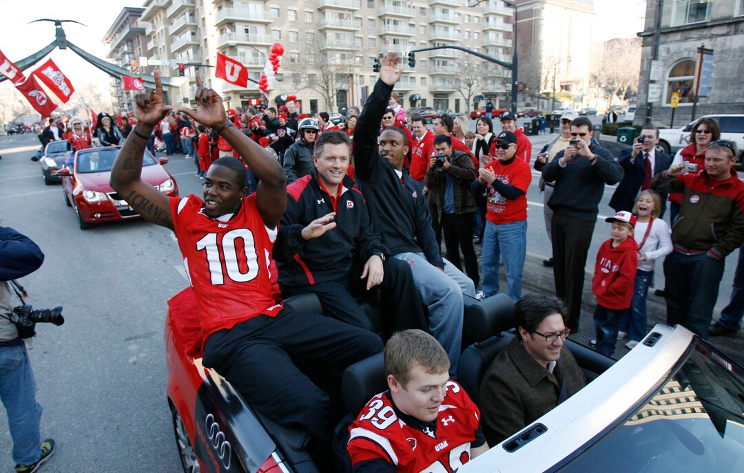 (Francisco Kjolseth  |  Tribune file photo)  Salt Lake City - Utah's Stevenson Sylvester, coach Kyle Whittingham and quarterback Brian Johnson, from left,  and Clint Mower, below, greet the crowds as the University of Utah's unforgettable 2008 football season officially ends on Friday, Jan. 16, 2009 with large crowds of fans descending on downtown Salt Lake City for a team that won 13 straight games in every conceivable manner.
