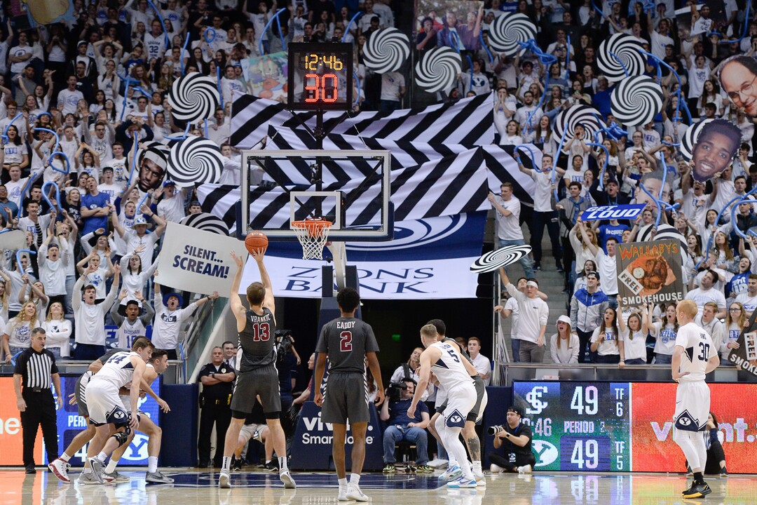 (Francisco Kjolseth  |  The Salt Lake Tribune) The BYU student section ramps up the distraction as Santa Clara Broncos forward Josip Vrankic (13) tries for a three pointer in the second half as the Brigham Young Cougars host the Santa Clara Broncos at the Marriott Center in Provo, Thursday, Feb. 20, 2020. BYU won 85-75.