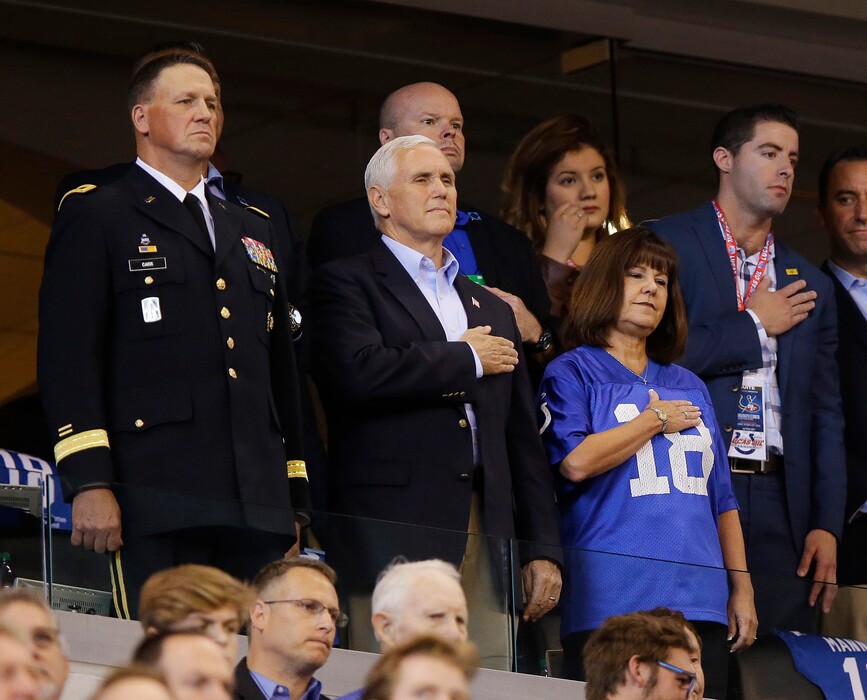 Vice President Mike Pence, front center, stands during the playing of the national anthem before an NFL football game between the Indianapolis Colts and the San Francisco 49ers, Sunday, Oct. 8, 2017, in Indianapolis. (AP Photo/Michael Conroy)