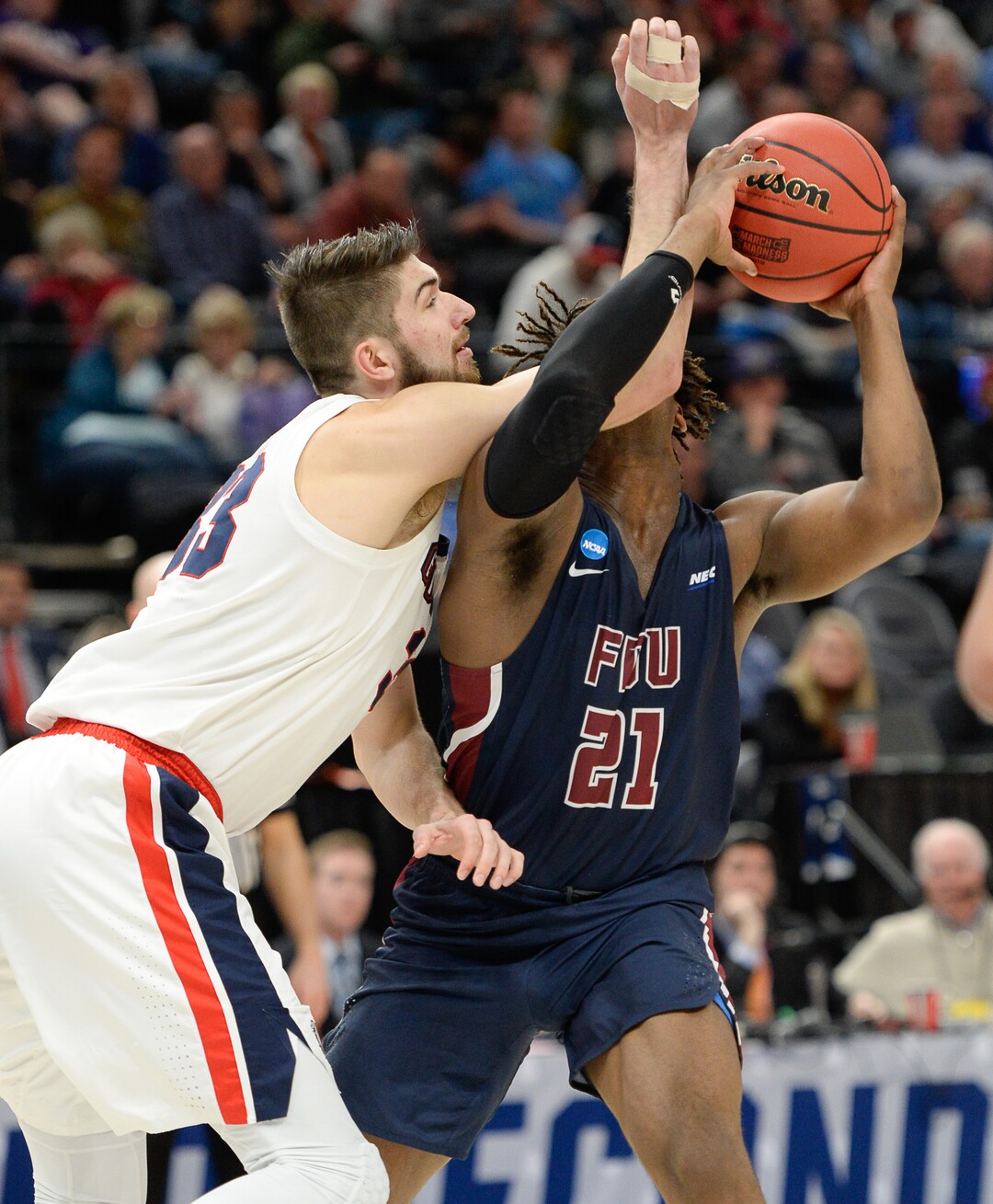(Francisco Kjolseth  |  The Salt Lake Tribune)  Gonzaga Bulldogs forward Killian Tillie (33) delivers an arm full on Fairleigh Dickinson Knights forward Elyjah Williams (21) as Gonzaga faces Fairleigh Dickinson in their first round menÕs NCAA March Madness tournament game at Vivint Smart Home Arena in Salt Lake City on Thursday, March 21, 2019.