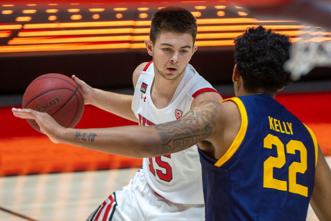 (Rick Egan | The Salt Lake Tribune)  Utah Utes guard Rylan Jones (15) makes a move as California Golden Bears forward Andre Kelly (22) defends, in PAC12 Basketball action between the Utah Utes and the California Golden Bears, on Wednesday, Jan. 16, 2021.