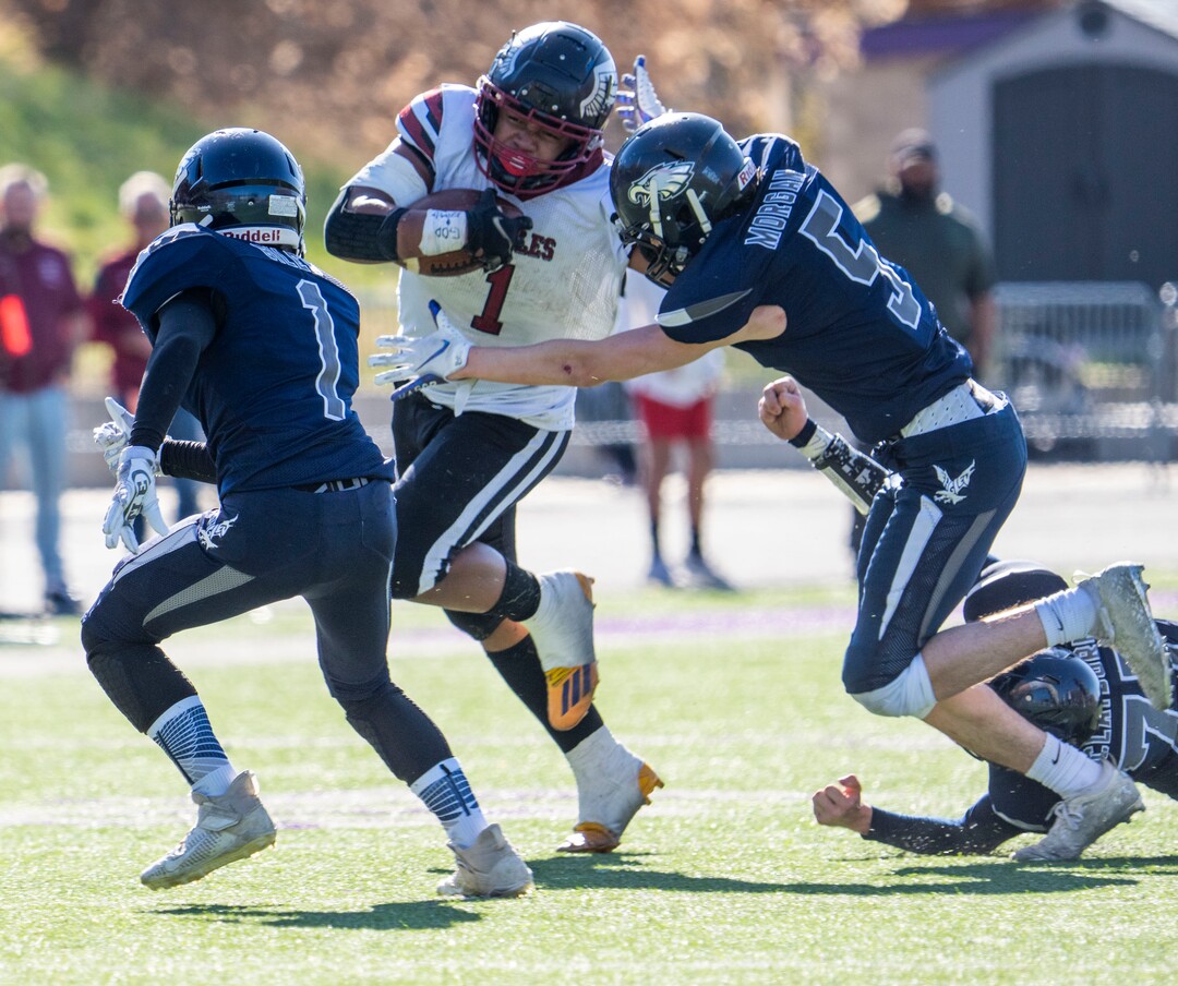 (Rick Egan | The Salt Lake Tribune) Layton Christian Academy running back Manu Lutui Vaitaki (1) runs the ball for the Eagles, as Duchesne linebacker Kodah Morgan moves in for the tackle, in 1A Football Championship action between the Duchesne Eagles and the Layton Christian Academy Eagles, at the Elizabeth Dee Shaw Stewart Stadium in Ogden, on Saturday, Nov. 13, 2021.