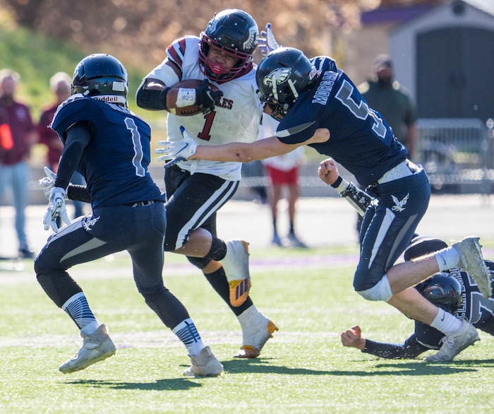 (Rick Egan | The Salt Lake Tribune) Layton Christian Academy running back Manu Lutui Vaitaki (1) runs the ball for the Eagles, as Duchesne linebacker Kodah Morgan moves in for the tackle, in 1A Football Championship action between the Duchesne Eagles and the Layton Christian Academy Eagles, at the Elizabeth Dee Shaw Stewart Stadium in Ogden, on Saturday, Nov. 13, 2021.