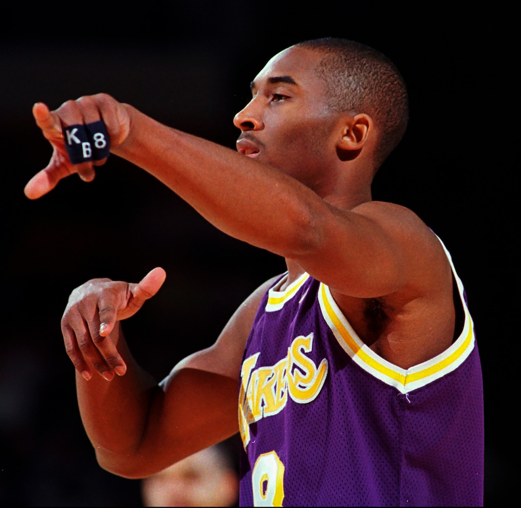 Los Angeles Lakers guard Kobe Bryant directs traffic on Feb. 13, 1997, against the Denver Nuggets in Denver. (AP Photo/Joe Mahoney)