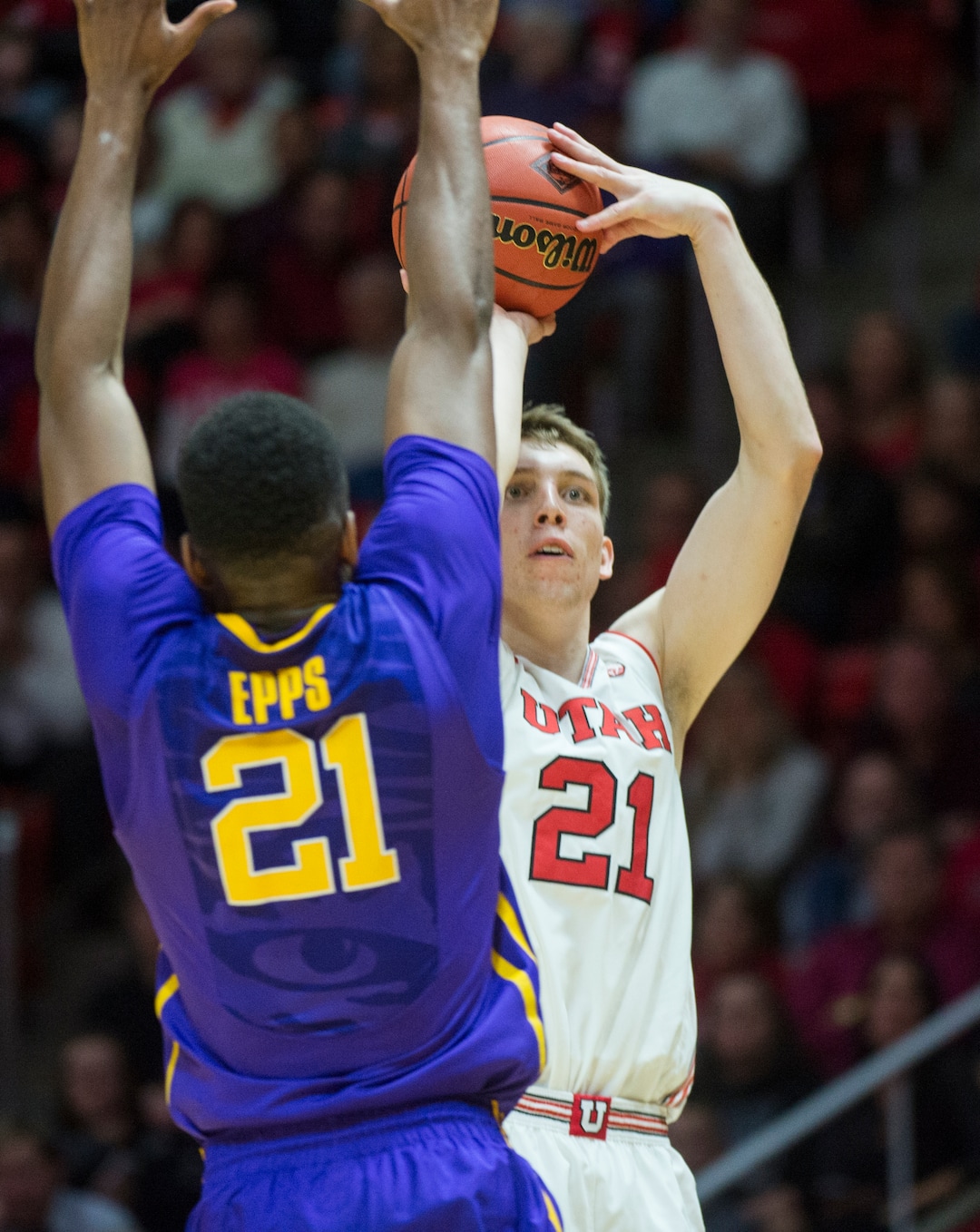 (Rick Egan  |  The Salt Lake Tribune)    Utah Utes forward Tyler Rawson (21) shoots over LSU Tigers forward Aaron Epps (21), in NIT playoff action between Utah Utes and LSU Tigers at the Jon M. Huntsman Center, Monday, March 19, 2018.