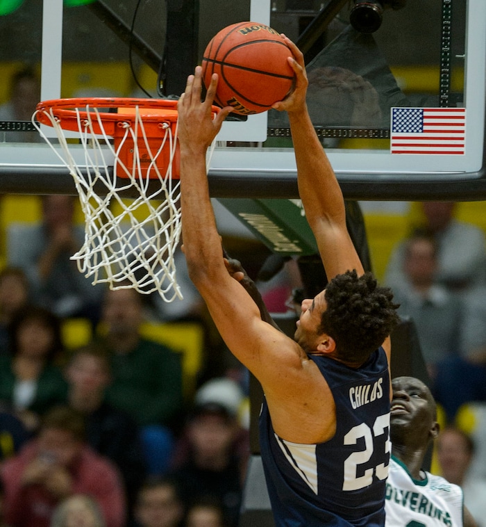(Steve Griffin  |  The Salt Lake Tribune) Brigham Young Cougars forward Yoeli Childs (23) gets to the rim for a dunk during the BYU versus UVU basketball game at UCCU Center on the UVU campus in Orem Wednesday November 29, 2017.