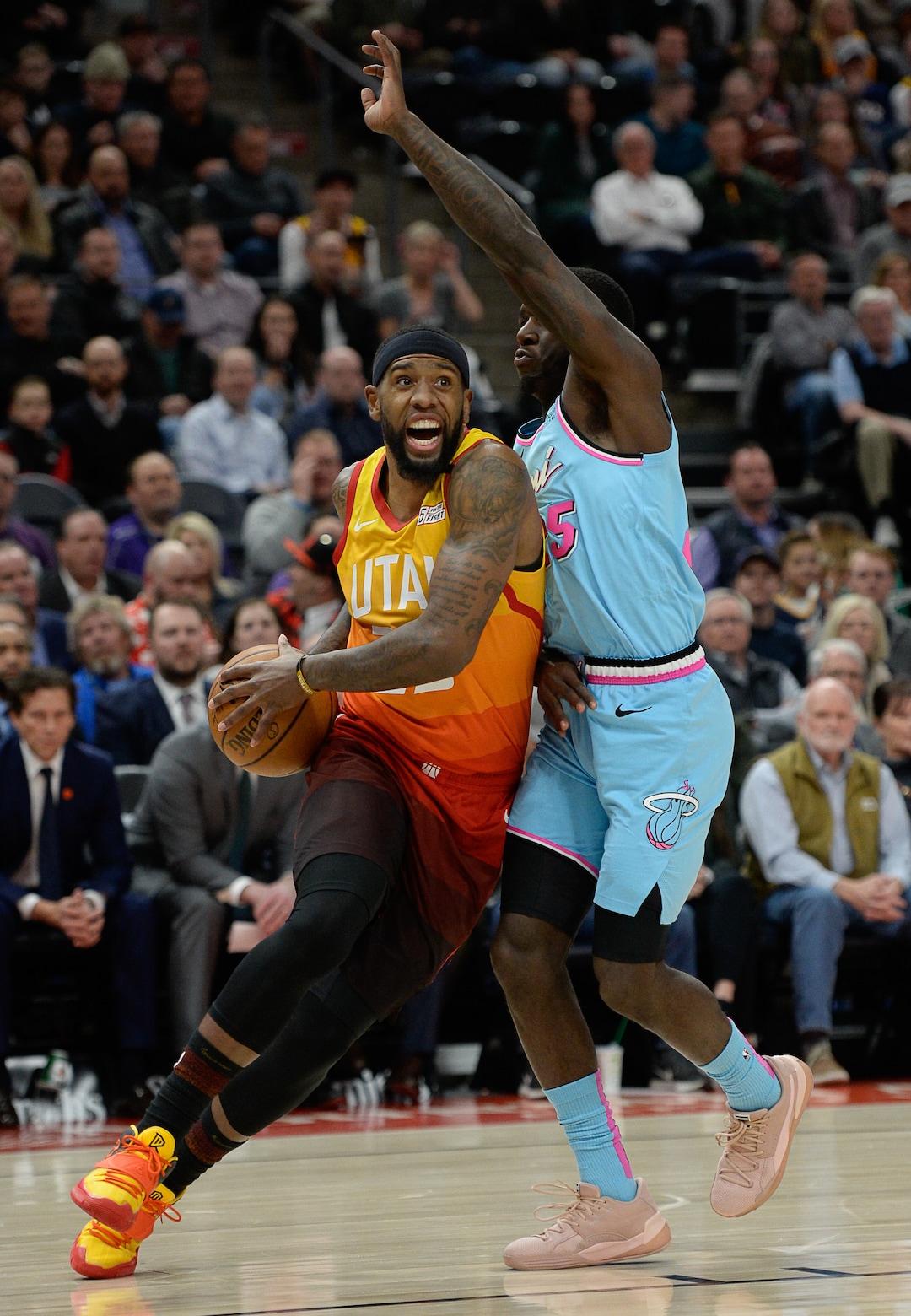 (Francisco Kjolseth  |  The Salt Lake Tribune) Utah Jazz forward Royce O'Neale (23) drives the ball on Miami Heat guard Kendrick Nunn (25) as the Utah Jazz host the Miami Heat in their NBA basketball game at Vivint Smart Home Arena in Salt Lake City on Wednesday, Feb. 12, 2020.