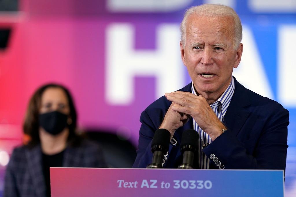 (Carolyn Kaster | AP photo)

Democratic presidential candidate former Vice President Joe Biden speaks as Democratic vice presidential candidate Sen. Kamala Harris, D-Calif., listens at the Carpenters Local Union 1912 in Phoenix, Thursday, Oct. 8, 2020, to kick off a small business bus tour.
