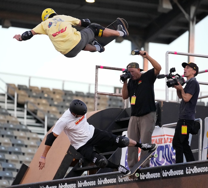 (Francisco Kjolseth | The Salt Lake Tribune) Iconic skateboarder Tony Hawk is jumped by Andrew McDonald as they put on a show for the “Legends Demo” at the Tony Hawk Vert Alert big-air skateboarding competition at the Utah Sate Fairpark on Friday, Aug. 26, 2022. 