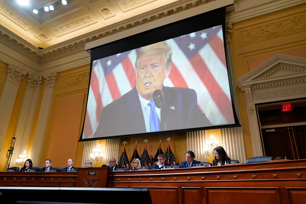 (J. Scott Applewhite | AP Photo) A video of former President Donald Trump is shown on a screen, as the House select committee investigating the Jan. 6 attack on the U.S. Capitol holds its final meeting on Capitol Hill in Washington, Monday, Dec. 19, 2022.