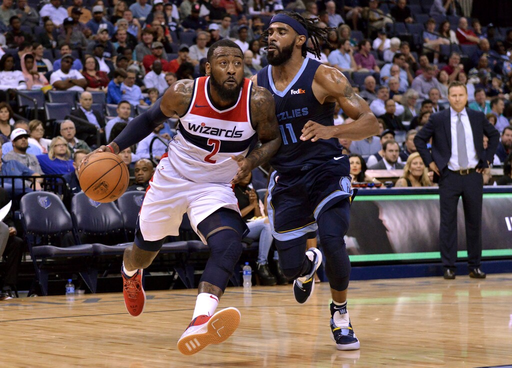 Washington Wizards guard John Wall (2) drives against Memphis Grizzlies guard Mike Conley (11) in the first half of an NBA basketball game, Tuesday, Oct. 30, 2018, in Memphis, Tenn. (AP Photo/Brandon Dill)