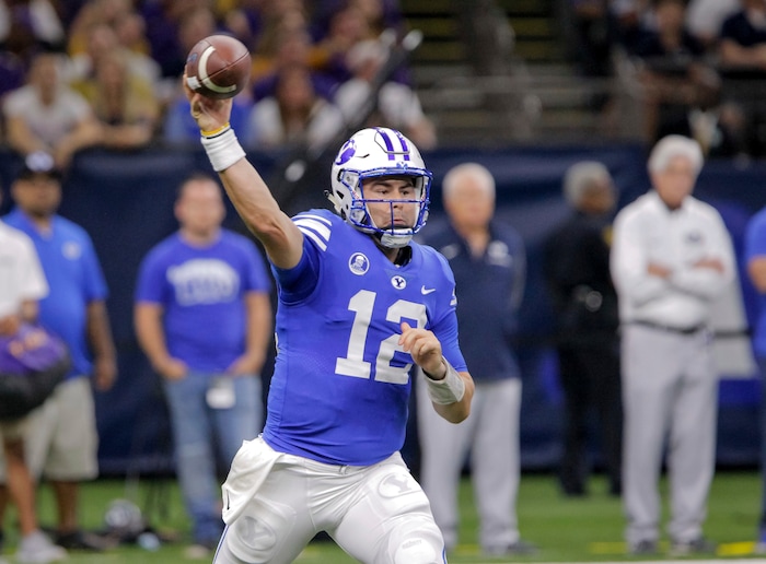 BYU quarterback Tanner Mangum (12) passes against LSU in the first half of an NCAA college football game in New Orleans, Saturday, Sept. 2, 2017. (AP Photo/Scott Threlkeld)