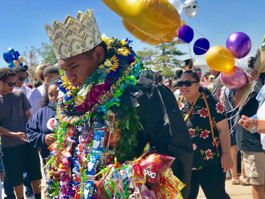 Sara Tabin/ The Salt Lake Tribune
 A graduating student wears celebratory necklaces made of treats and flowers at the ceremony Wednesday.