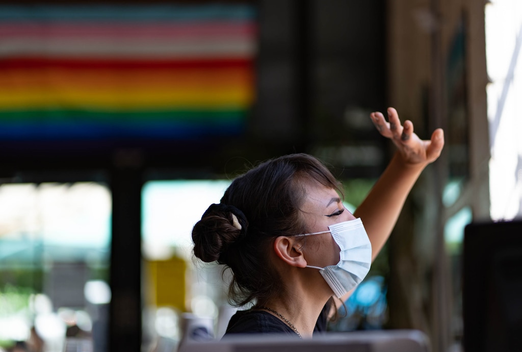 (Francisco Kjolseth | The Salt Lake Tribune) Jera Peterson works the order window at Sugar House Coffee as she waves to a friend during a recent shift on Friday, May 28, 2021. 