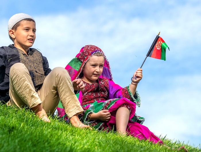 (Rick Egan | The Salt Lake Tribune) 
Muhammad-Ali Mustafawi and Aiza Mustafawi gather at Murray Park for a prayer vigil in honor of UtahÕs Afghan refugees, onSaturday, Aug. 21, 2021.
