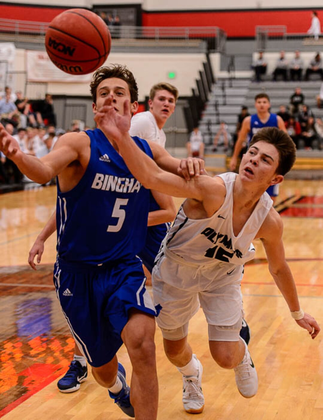 (Trent Nelson | The Salt Lake Tribune)  Bingham's Dax Milne and Olympus's Rylan Jones as Olympus faces Bingham, high school boys' basketball at the Utah Elite 8 tournament in American Fork, Thursday December 7, 2017.