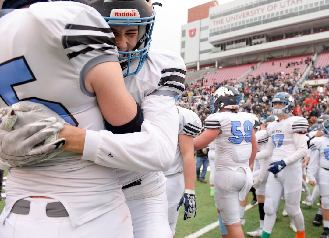 (Leah Hogsten  |  The Salt Lake Tribune)  Sky ViewÕs Tate Ballard and Kason Flaherty celebrate the win. Sky View High School defeated Park City 35-0 to win the 4A State Championship football title, Nov. 11, 2019 at Rice-Eccles Stadium.