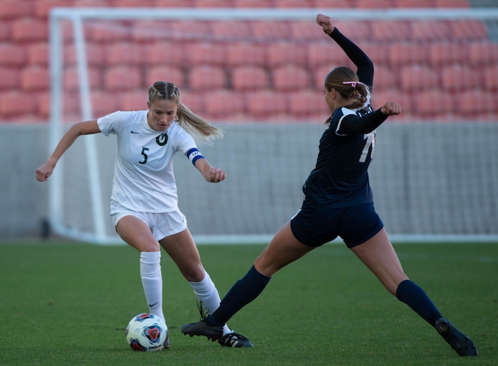 (Francisco Kjolseth  |  The Salt Lake Tribune) Lily Webster #5 of Olympus tries to move past Courtnie Porter #10 of Bonneville as they compete in their 5A high school girls championship game at Rio Tinto Stadium in Sandy on Friday, Oct. 23, 2020. Bonneville went on to win 1-0 in overtime.