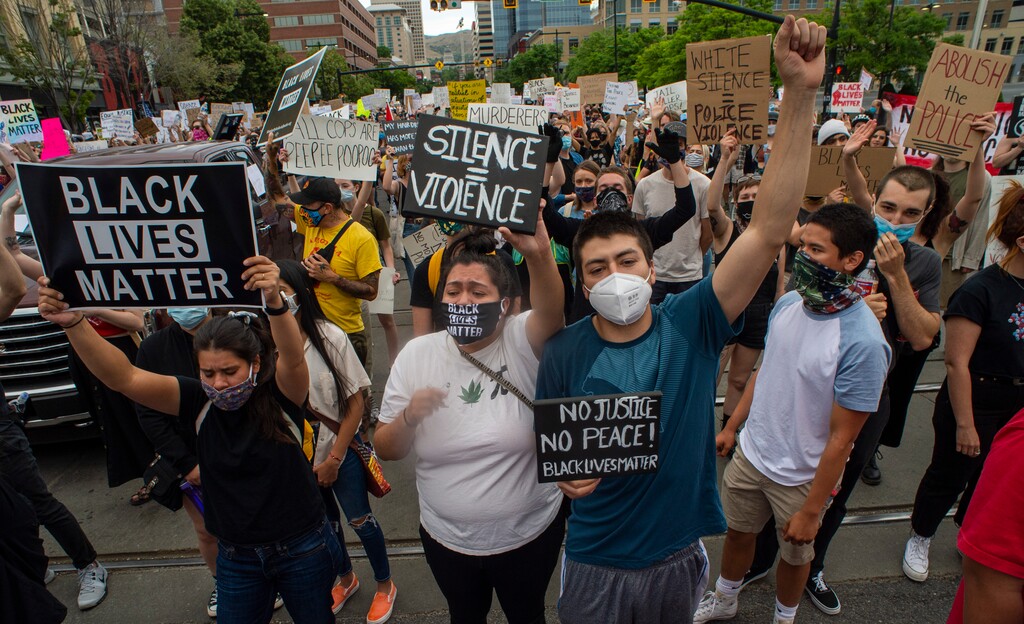 (Rick Egan  |  The Salt Lake Tribune) Protesters march down State Street in Salt Lake City on Saturday, June 13, 2020.
