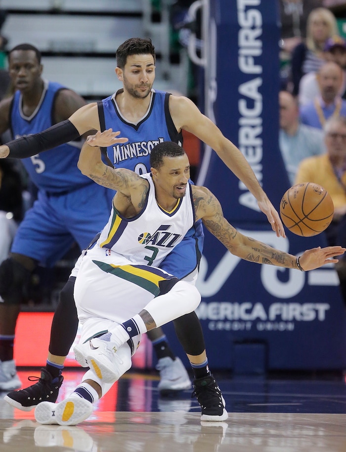 Utah Jazz guard George Hill (3) falls as Minnesota Timberwolves guard Ricky Rubio (9) defends during the first half in an NBA basketball game Wednesday, March 1, 2017, in Salt Lake City. (AP Photo/Rick Bowmer)
