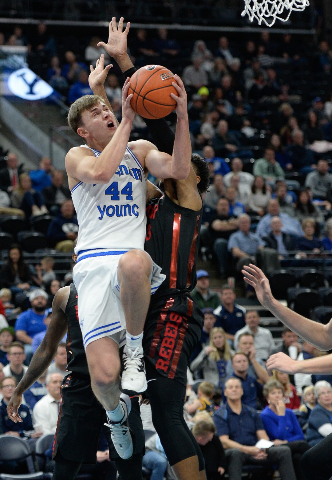 (Francisco Kjolseth  |  The Salt Lake Tribune)  Brigham Young Cougars guard Connor Harding (44) manages to push past UNLV Rebels guard Bryce Hamilton (13) as BYU takes on UNLV in men's NCAA basketball at Vivint Smart Home Arena in Salt Lake City on Sat. Dec. 7, 2019.