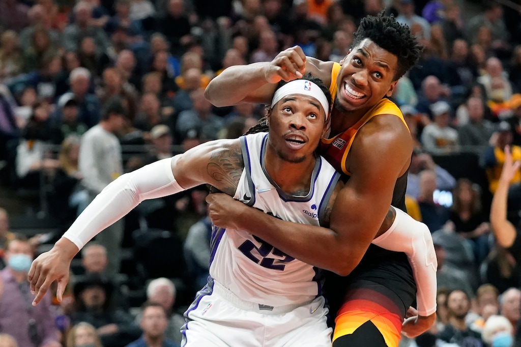 (Rick Bowmer | AP) Utah Jazz center Hassan Whiteside, right, and Sacramento Kings center Richaun Holmes (22) vie for position under the boards during the second half of an NBA basketball game Tuesday, Nov. 2, 2021, in Salt Lake City.