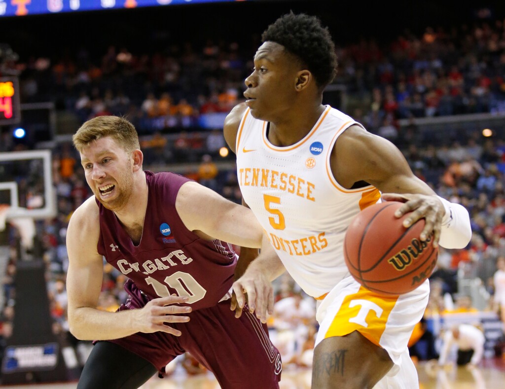Tennessee's Admiral Schofield (5) drives past Colgate's Will Rayman (10) in the first half of a first-round game in the NCAA men’s college basketball tournament in Columbus, Ohio, Friday, March 22, 2019. (AP Photo/Paul Vernon)