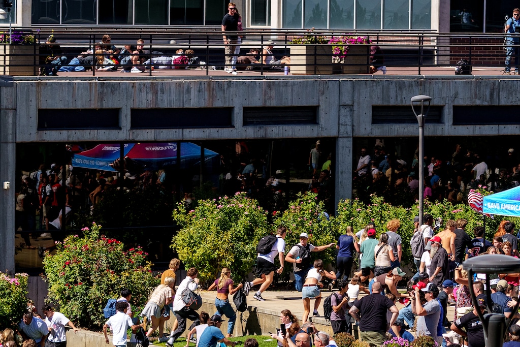 (Trent Nelson | The Salt Lake Tribune) People run after Charlie Kirk was shot at Utah Valley University in Orem on Wednesday, Sept. 10, 2025.