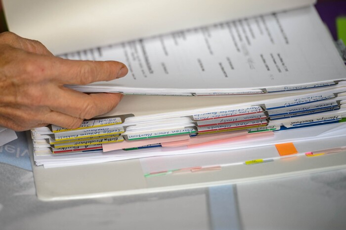(Trent Nelson  |  The Salt Lake Tribune) Sunny Lee flips through some of her files. Lee works with the South Korean government to bring the families of MIA Korean War veterans to South Korea where they are honored for their family member's service. Lee was photographed at her Springdale home on Tuesday, May 19, 2020.