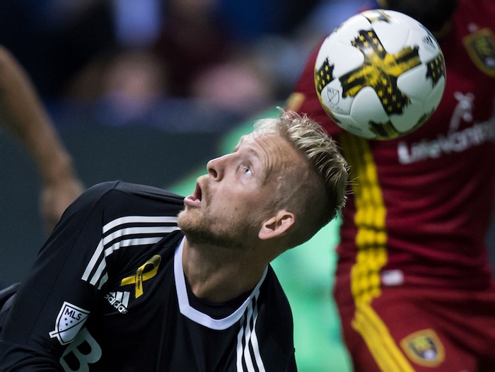 The ball bounces over Vancouver Whitecaps goalkeeper David Ousted's head and enters the net for a goal by Real Salt Lake's Chris Wingert, not seen, during first half MLS soccer action in Vancouver, B.C., on Saturday, September 9, 2017. THE CANADIAN PRESS/Darryl Dyck/The Canadian Press via AP)