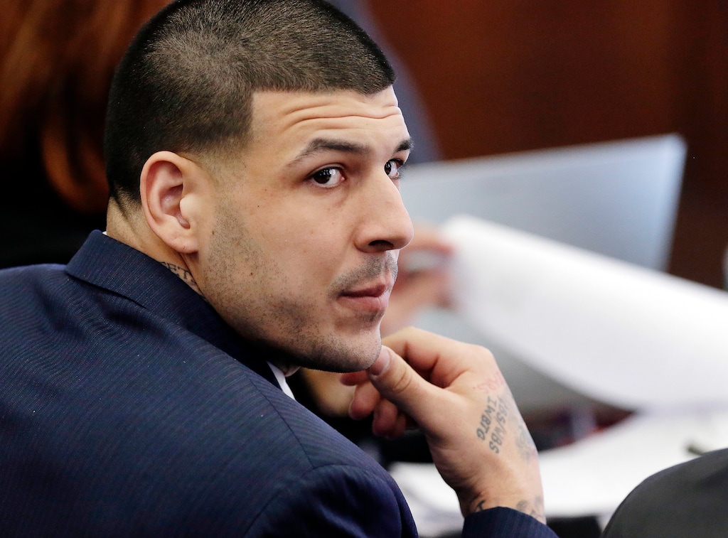 FILE - In this Wednesday, March 15, 2017, file photo, Defendant Aaron Hernandez listens during his double murder trial in Suffolk Superior Court, in Boston. Massachusetts prison officials said Hernandez hanged himself in his cell and pronounced dead at a hospital early Wednesday, April 19, 2017. (AP Photo/Elise Amendola, Pool, File)