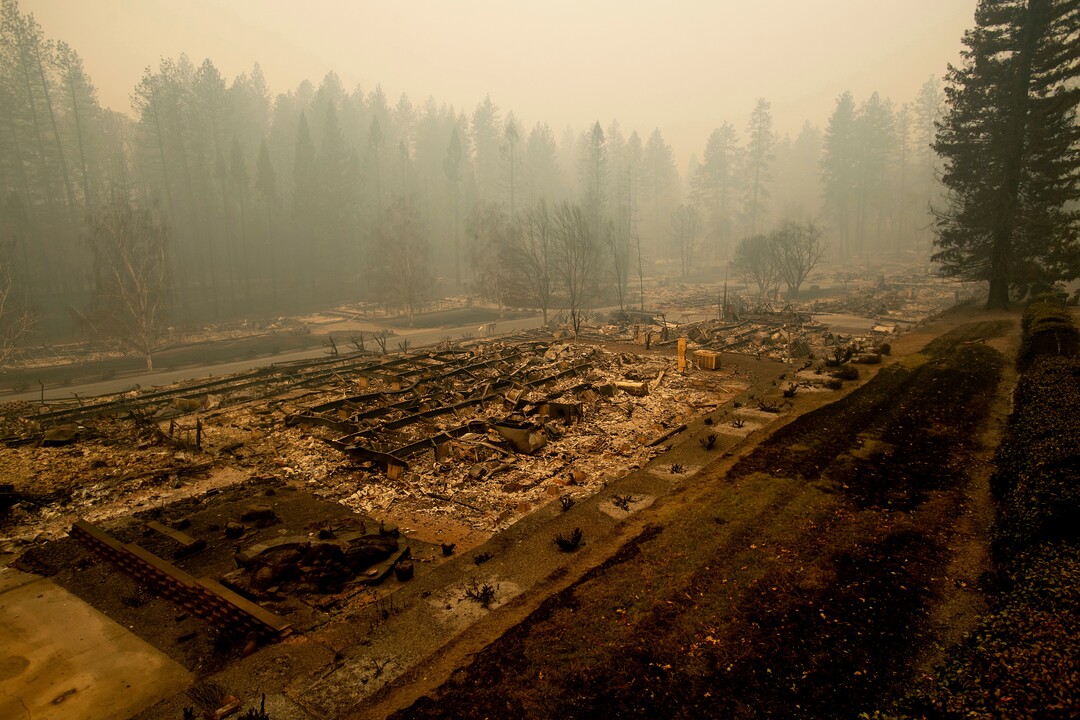 Leveled residences line a mobile home park on Edgewood Lane after the Camp Fire burned through Paradise, Calif., on Saturday, Nov. 10, 2018. Not much is left in Paradise after a ferocious wildfire roared through the Northern California town as residents fled and entire neighborhoods are leveled. (AP Photo/Noah Berger)