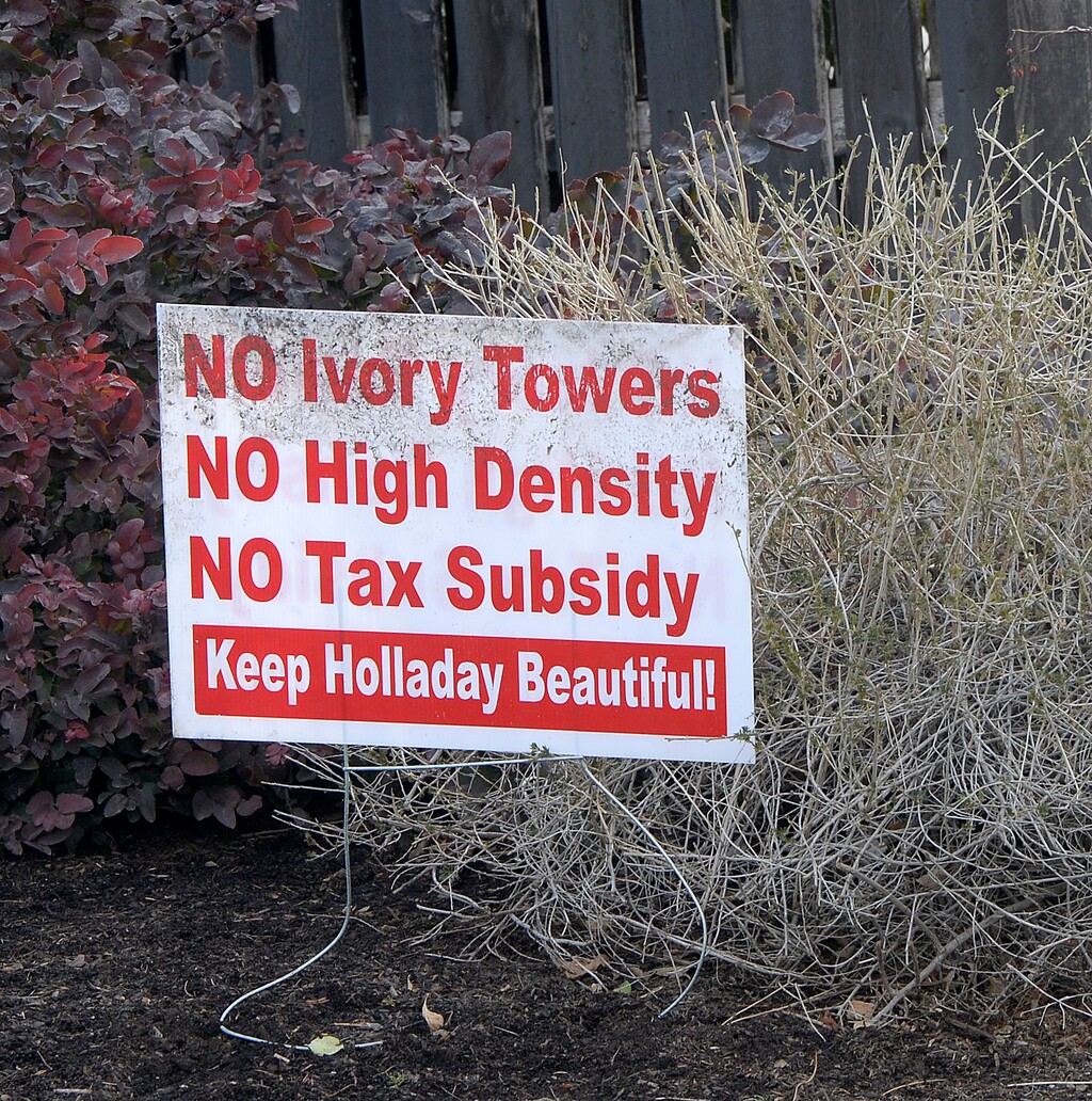 (Al Hartmann | Tribune file photo) Signs in the front yards of homeowners in the area of the old Cottonwood Mall site near 4800 S. Highland Drive in Holladay. The Utah Supreme Court heard arguments Friday on whether a Holladay City Council approval of zoning affecting the site can go to a public referendum in November.
