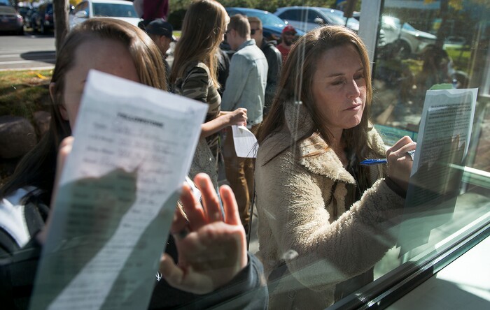(Leah Hogsten  |  The Salt Lake Tribune) l-r Parker Kvinge, 16, and her mother Laura Kvinge fill out required paperwork  during Saturday's casting call at Salt Lake Community College, October 14, 2017 to play an extra for the upcoming series "Yellowstone," filmed in Utah starring Kevin Costner.