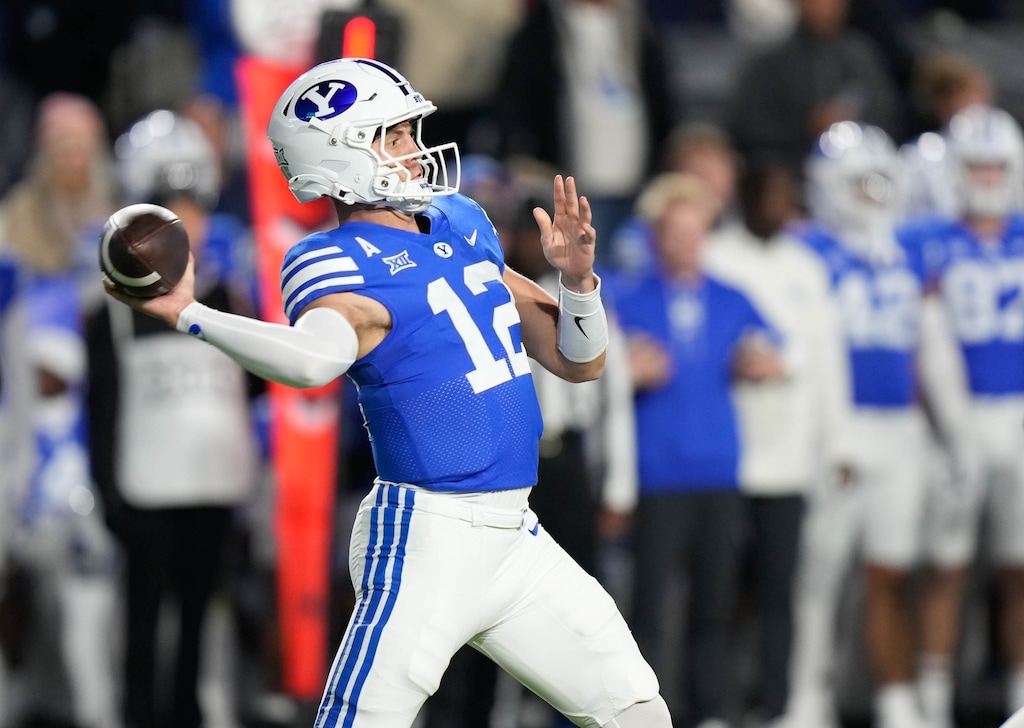 (Francisco Kjolseth  | The Salt Lake Tribune) Brigham Young Cougars quarterback Jake Retzlaff (12) makes a pass during the game between the Brigham Young Cougars and the Oklahoma State Cowboys in Provo on Friday, Oct. 18, 2024.