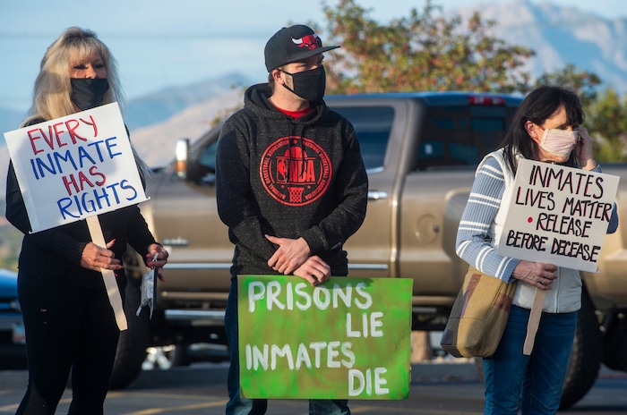 (Rick Egan  |  The Salt Lake Tribune)  Protesters gather for a rally for prison inmates, after a COVID-19 outbreak has spread at the Draper prison, at the Department of Corrections, on Tuesday, Oct. 13, 2020.