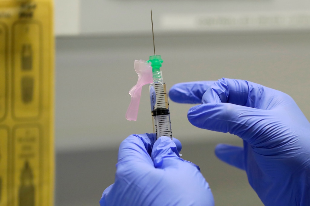 (Kirsty Wigglesworth | AP file photo)

In this Aug. 5 photo, senior Clinical Research Nurse Ajithkumar Sukumaran prepares the COVID 19 vaccine to administer to a volunteer, at a clinic in London.