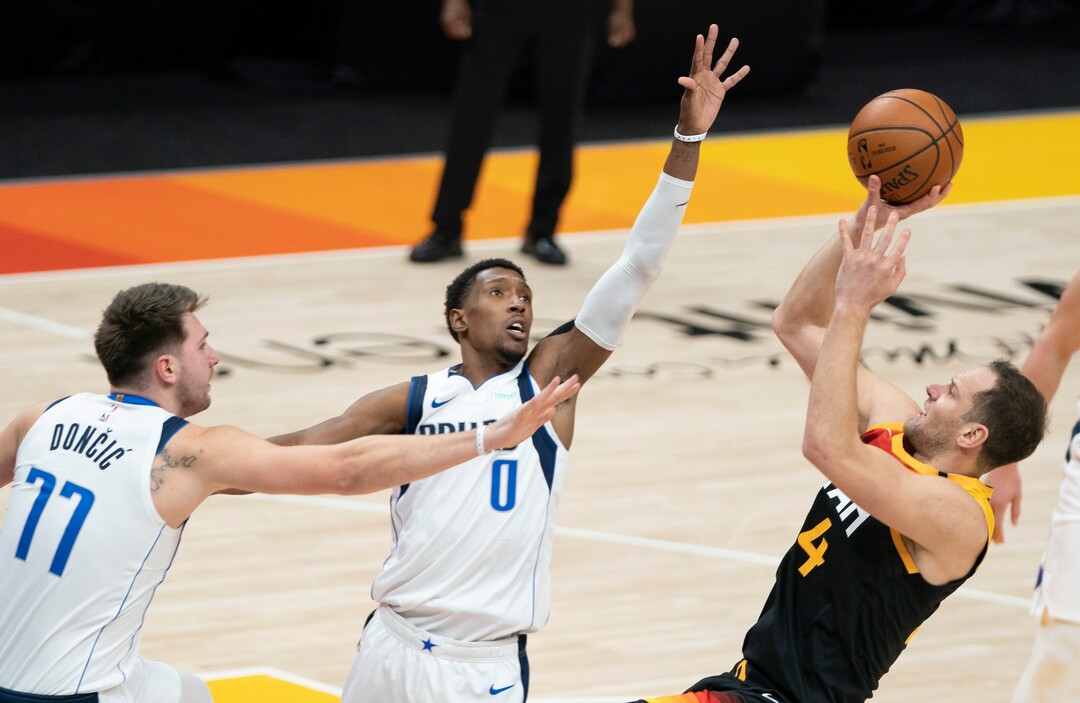 (Rick Egan | The Salt Lake Tribune)  Utah Jazz forward Bojan Bogdanovic (44) shoots as Dallas Mavericks guard Josh Richardson (0) and Dallas Mavericks guard Luka Doncic (77) defend, in NBA action between the Utah Jazz and the Dallas Mavericks at Vivint Arena, on Friday, Jan. 29, 2021.