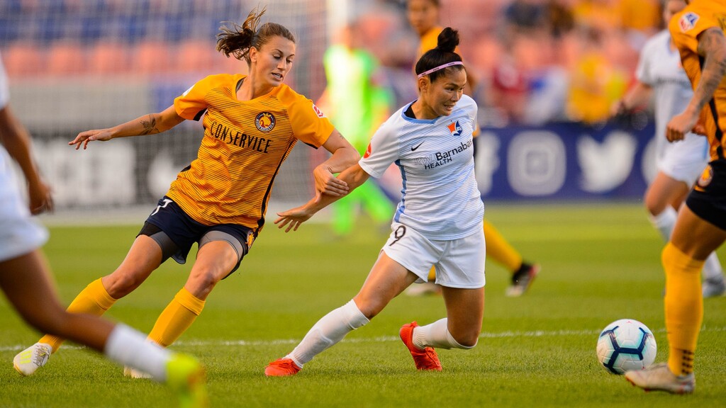 (Trent Nelson  |  The Salt Lake Tribune)  Utah Royals FC midfielder Mandy Laddish (7) and Sky Blue FC forward Nahomi Kawasumi (9) as Utah Royals FC hosts Sky Blue FC at Rio Tinto Stadium in Sandy on Saturday June 15, 2019.