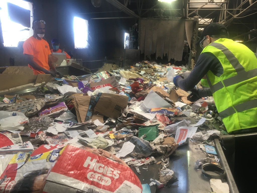 Photo courtesy Larry Gibbons, Rocky Mountain Recycling, June 25, 2018
Workers at Rocky Mountain Recycling sort municipal waste Monday at its Salt Lake City plant. This material arrives through the curbside pickup program conducted across all of Salt Lake County, which nets about 100,000 tons a year. Plastic material is bound for China, but much of it is contaminated, driving down its value for Chinese manufacturers and threatening the viability of curbside programs across the United States.