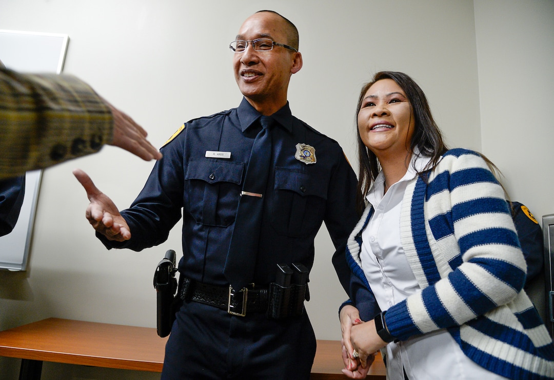 (Francisco Kjolseth  |  The Salt Lake Tribune)  Salt Lake City Airport Police officer Ran Kros is congratulated after getting pinned with a new badge by his wife Laura during a ceremony to retire their former patch and badge as the airport police force is subsumed into the Salt Lake City Police Department on Tuesday, Feb. 26, 2019. 