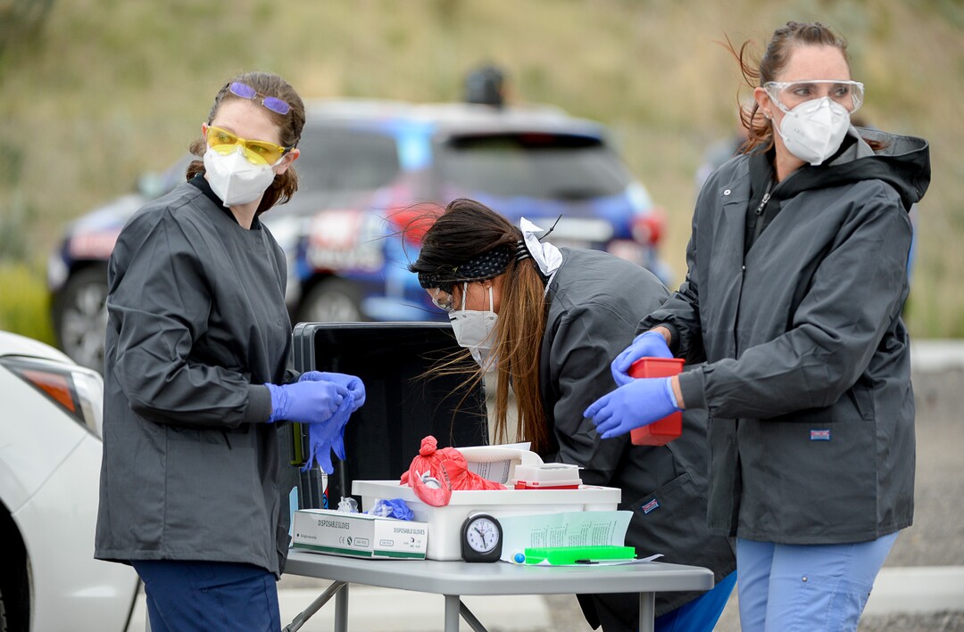 (Francisco Kjolseth  |  The Salt Lake Tribune) Healthcare workers perform COVID-19 antibody testing at the Galena Hills Park in Draper on Wednesday, May 20, 2020.