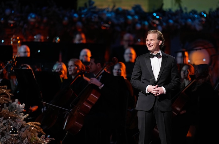 (Francisco Kjolseth | The Salt Lake Tribune) Sebastian Arcelus on stage with The Tabernacle Choir at Temple Square during its annual Christmas Concert on Thursday, Dec. 11, 2025,
